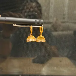 Traditional AD M Pinjada Cute Gold Tone Earrings with Delicate Design and Elegant Finish