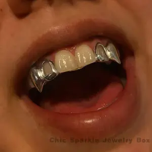 2pcs/SET Hip Hop Double Fang Teeth Grillz for Teeth Golden Color Plated Canine Two Tooth Upper Top Fangs Hollow Vampire Teeth Grills Jewelry symmetry on both sides  Oral Cosmetic