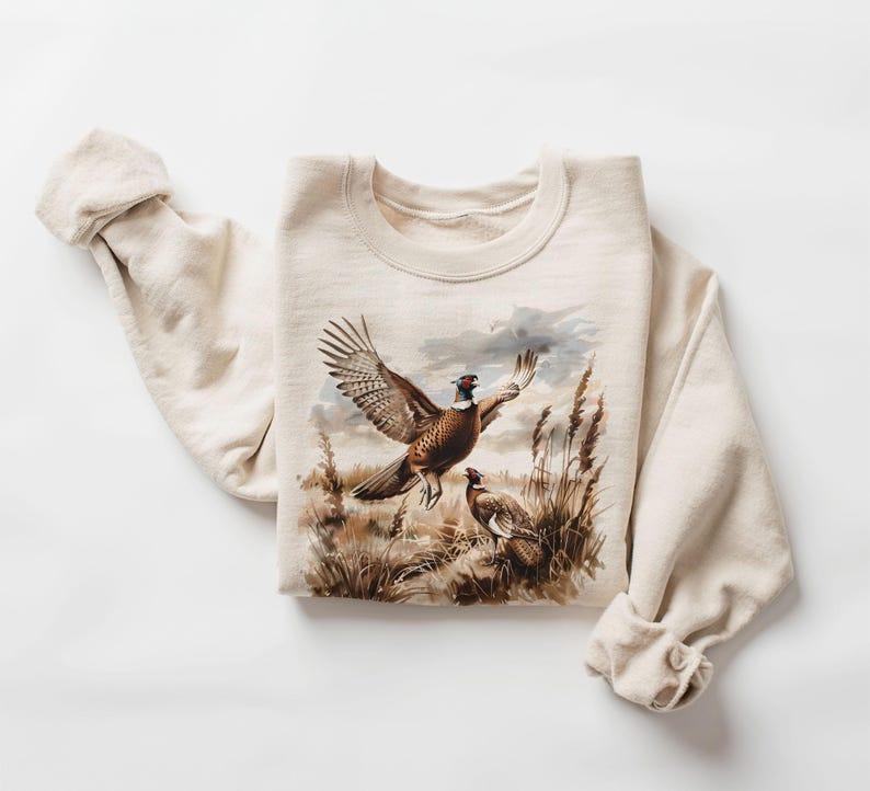 Pheasant Hunting Sweatshirt Casual Pullover Cotton Graphic Crewneck – Rustic Flying Game Bird Scene, Long Sleeve Round Neck, Soft Comfort for Women Hunters & Outdoor Lovers, All-Season