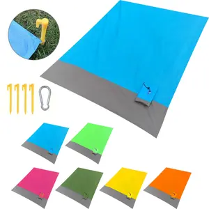 Waterproof and sandproof beach blanket with 4 corner anchors, foldable and portable outdoor camping picnic mat, suitable for travel, camping, hiking. A beach essential lightweight