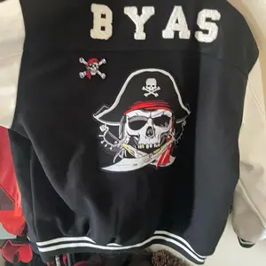 BYAS Collar Design Featuring Pirate Cap and Skull Graphic on Black Jacket