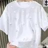 Unisex design featuring a water-crystal-embellished cross-shaped pattern on a T-shirt. A stylish, glam-inspired top that shines with modern design, perfect for showcasing refined and trendy fashion sense, suitable for everyday wear in school or at work,