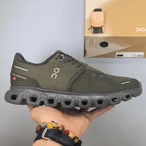 Retro running sneakers with flexible segmented shock-absorbing athletic silhouette, premium breathable knit mesh finished in matte olive green paired with slim silver reflective strip accents, hollow dark gray foam midsole