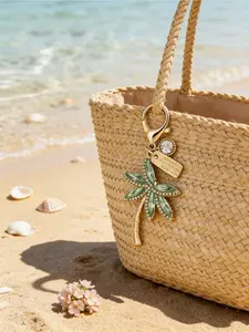Golden rhinestone palm tree keychain with lobster clasp. Tropical beach style for daily wear and summer travel. Fits keys, bags and car accessories. Great holiday and birthday gift for women.