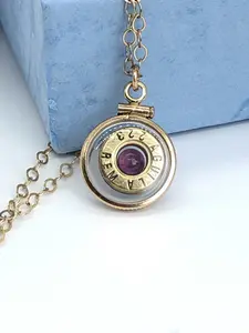 Handmade 14k gold filled .223 cal bullet view locket, finished with a 4mm genuine garnet gemstone, view from both sides