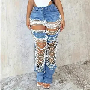 High-waisted washed jeans with pearl embellishments for a festive and night out vibe! Y2K Hip-Hop Glam Edgy denim with luxurious details
