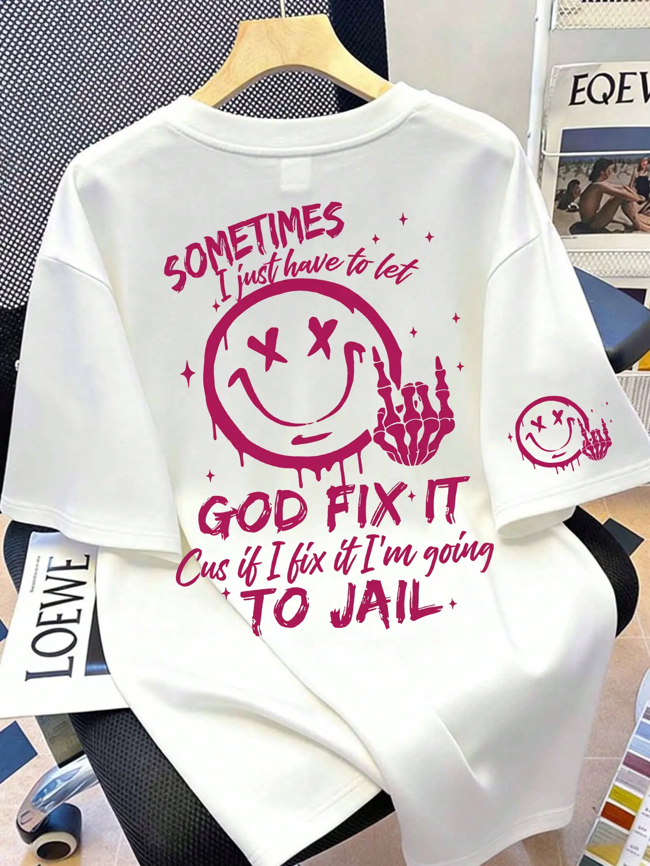 Dripping X‑Eye Smiley With Skeleton Hand Back Print Mini Matching Smiley Sleeve Graphic Tee | “Cus If I Fix It I’m Going To Jail” Relatable Humor Everyday Oversized Casual Shirt