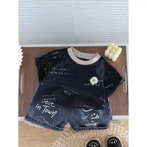 New summer fashion outfit boys: black short-sleeve T-shirt with "M" letter design, paired with ripped denim shorts, suitable various outdoor occasions