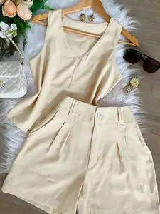 Office-style two-piece set: V-neck sleeveless ruffled top + high-waisted pleated shorts—an elegant casual and professional outfit for women.