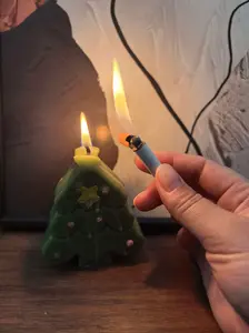 (A unique shaped lighter without butane, which can be put into a box and carried around. A small one. As a gift. For New Year. To give as a present. To a father.)