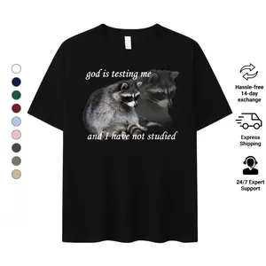 God Is Testing Me Raccoon Shirt | Academic Weapon Funny Student Tee | Procrastination Meme Graphic T-Shirt