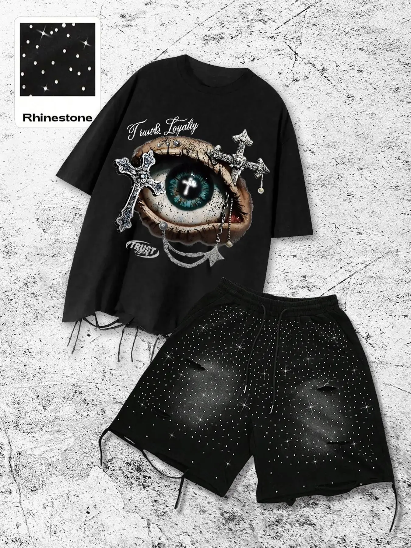 This men's matching two-piece set includes a casual T-shirt with a cross, letter, and eye print, and shorts adorned with rhinestones and distressed details, creating a stylish streetwear look suitable for all seasons Outfit