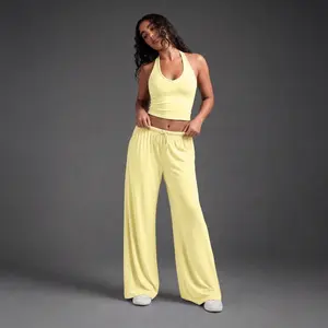 Calorie Club women’s quick-dry sports tank top, casual high-waisted flared pants, comfortable sporty style, solid color design suitable for all seasons