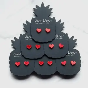 Dixie Bliss micro confetti red glitter heart earrings on hypoallergenic surgical steel posts.