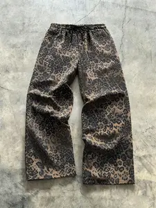 Unisex street style leopard-print full-length pants with a relaxed fit, drawstring waistband, comfortable and casual design. Perfect for casual daily wear, stylish and sensual leopard prints suitable for hip-hop, school events, parties, and commuting.