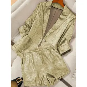 A women’s gold two-piece set featuring a textured blazer and shorts, suitable for autumn and winter, ideal for wearing at home, indoors, and outdoors.