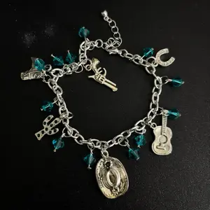 Blue Cowgirl Charm Bracelet with Horseshoe Boot Bull Skull and Star Charms Gold Chain Fashion Jewelry