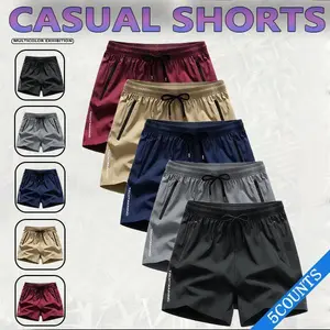 5 men's casual sports shorts -wrinkle-resistantpolyester blend fabric,loose fit with drawstringwaistband,solid color, suitable for the gym, outdooractivities, and everyday wear,simple designlsmoothtexture