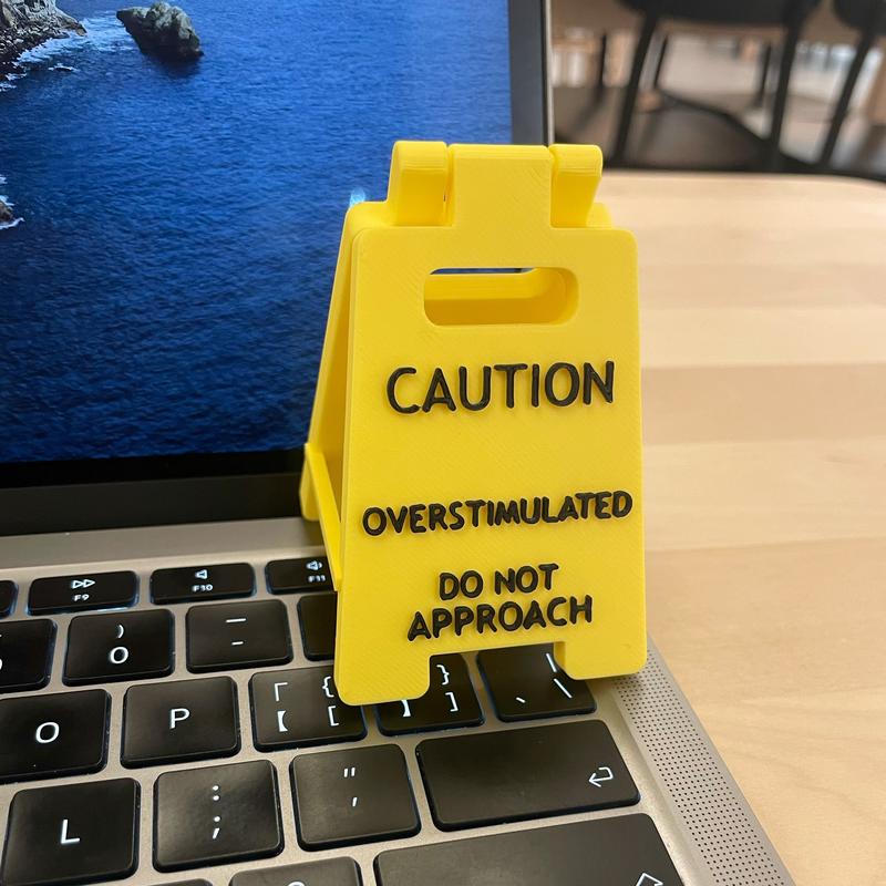 Caution Overstimulated Desk Sign - Yellow Sign with Black Text,  Humor Gag Gift for Coworkers, Boss & Employees, Mini Novelty Funny Desk Decor