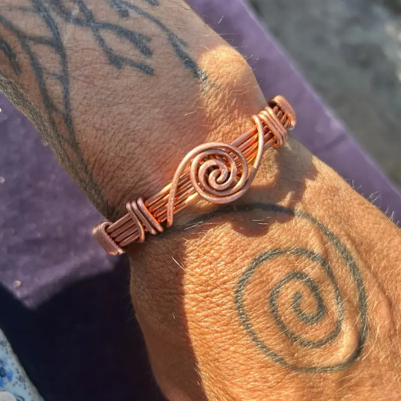 Spiraling copper hand woven bracelet for true style and practical uses