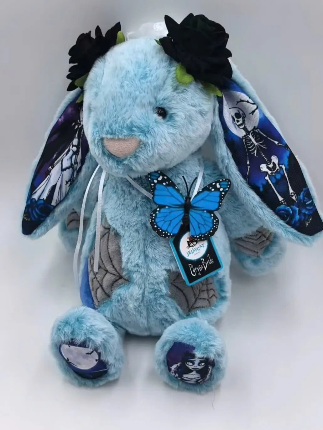 Jellycat Halloween Corpse Bride Bunny Plush – Blue Gothic Rabbit with Black Rose Crown, Butterfly Detail & Skeleton Ear Design, Spooky Stuffed Animal Gift for Halloween Collectors