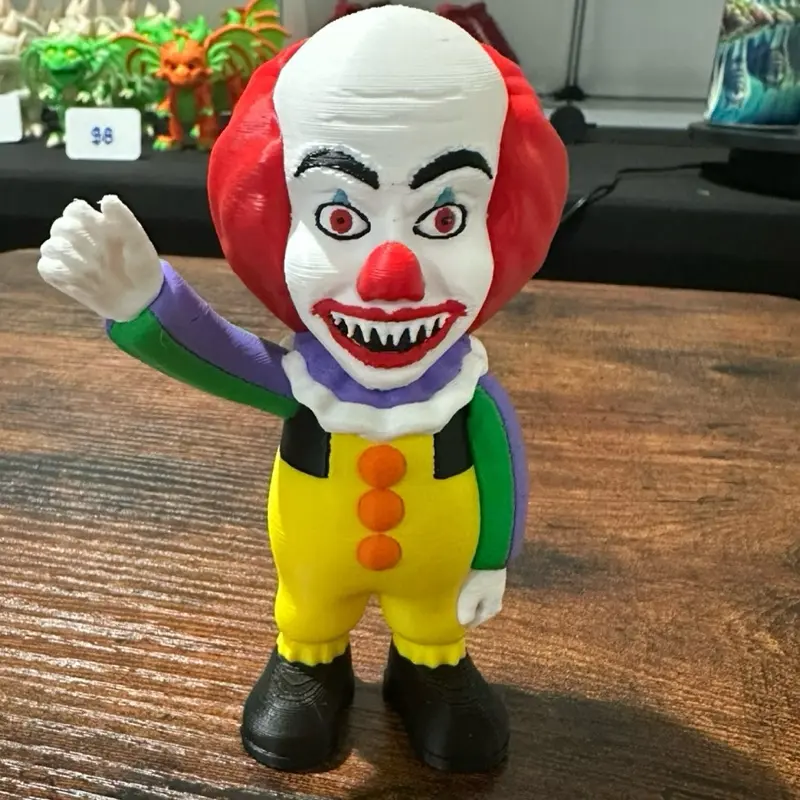 Pennywise Horror Character Figurine with Distinctive Red Nose and Vibrant Costume for Collectors