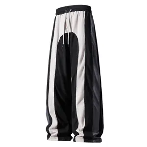 Men’s American high-street black-and-white striped patchwork corduroy wide-leg pants for spring/autumn, loose straight fit with a drapey feel, drawstring elastic waistband, casual athletic long pants