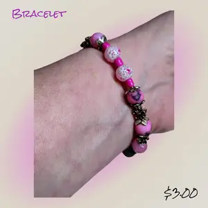 "Flower Power Blossoms In Pink: Handmade Beaded Bracelet With Floral Accent Charms."