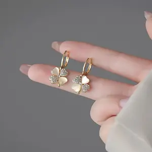 A pair of women's rhinestone four-leaf clover earrings, elegant gold pendant fashion jewelry, stud earrings