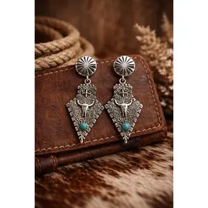THE LONGHORN CONCH EARRINGS