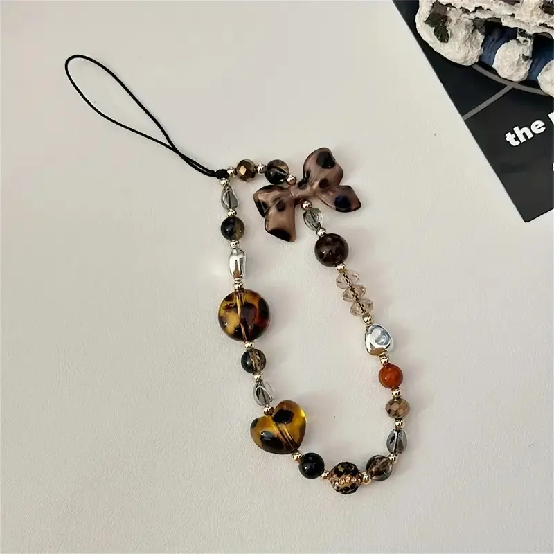 Leopard print bowknot beaded phone chain, a short wrist accessory design, a multi-functional retro pendant specially created for women, a practical accessory for phone case anti-loss lanyard, Phone Accessories, Phone Charms, Vintage
