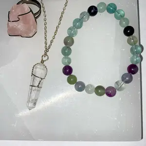 Bundle for aligning mind, body, spirit. Includes adjustable rose quartz ring, clear quartz necklace, fluorite bracelet.
