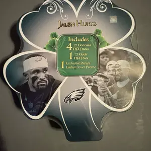 Jalen Hurts Limited Edition Panini NFL Shamrock Tin with 4 2025 Donruss Packs and 1 2025 Optic Pack! That’s 5 chances to pull a DOWNTOWN or UPTOWN