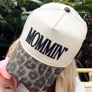 Mommin' Vintage Trucker Hat Snapback Adjustable Closure Black Bill with Tan Embroidery Year Round Use Hand Wash Only