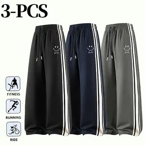 3 PCS Men's Casual Wide Leg Sports Pants With Smile Print Elastic Waist Drawstring And Side Stripes For Fitness Running And Daily Wear In Black Navy And Grey Colors