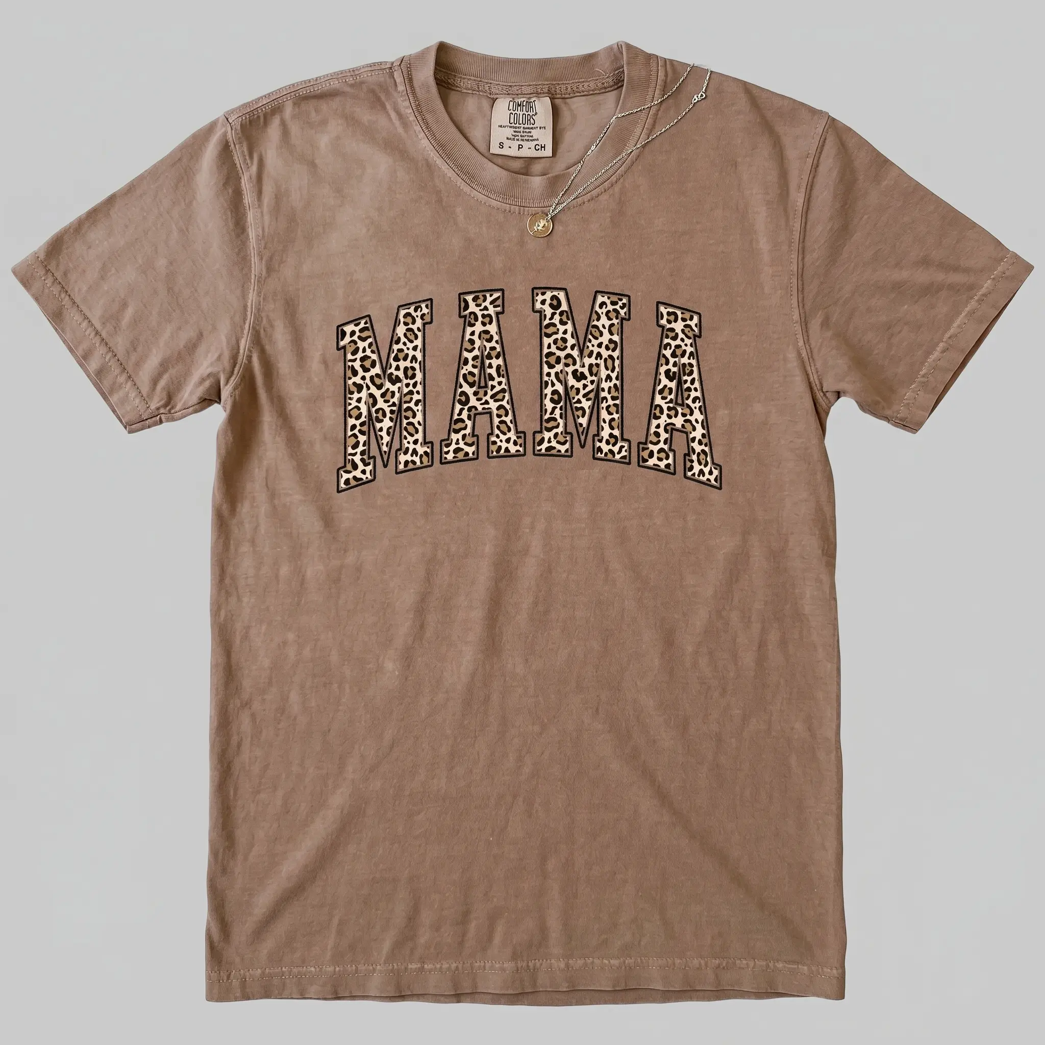 Comfort Colors Leopard Mama shirt, a fun and stylish tee perfect for Mother’s Day, new moms, pregnancy announcements, or as a cute and funny mom gift. Womenswear Top