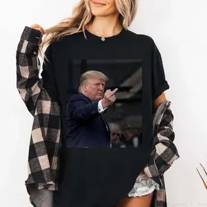 New T-shirt capturing a moment Trump reacting to a heckler at the Ford plant. Designed for both men and women.