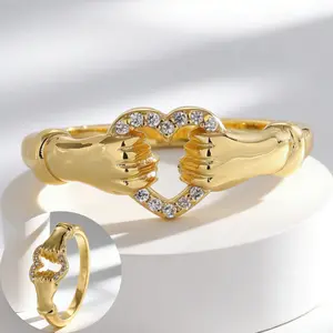 14k gold-plated ring with interlocking hearts, set with small Zirconia stones, suitable for everyday wear, as a gift, or for parties