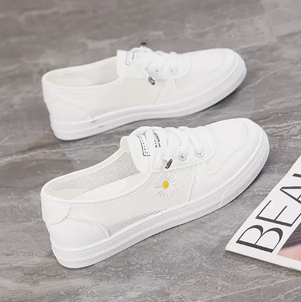 Ultra-airy white mesh canvas casual sneakers, flexible pale cream rubber thick sole. Clean ivory tone with cute daisy accent pairs sundresses, jeans for park picnics, seaside walks and weekend coffee dates.