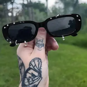 European/American punk sunglasses with small square frames and studded details, transparent gel frame, fashionable street-style punk denim look