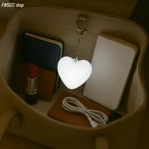 Compact heart-shaped LED night light with USB rechargeable design and touch control. It emits soft gentle glow, lightweight and portable as a keychain lamp. Perfect for travel, bedroom decor and love-themed mini gifts.