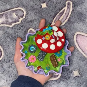 Mushroom House Figurine - Floral Design with Red Mushrooms, Purple Leaf, and Brown Accents