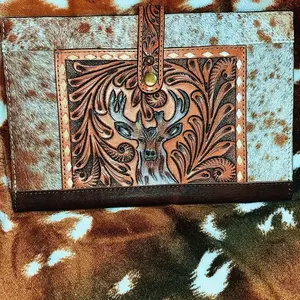 Deer tooled leather and hide book cover