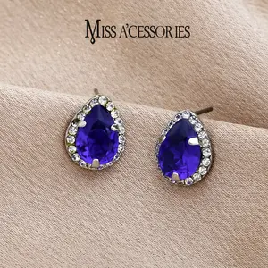 Pear Cut Blue Crystal Stud Earrings | Viral Simulated Sapphire Statement Earrings | Elegant Simulated Sapphire Teardrop Earrings | Silver Tone CZ Halo Setting |  Y2K Party Wear for Women