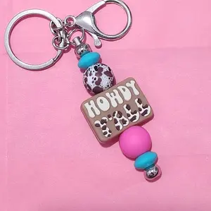 cow print howdy yall keychain