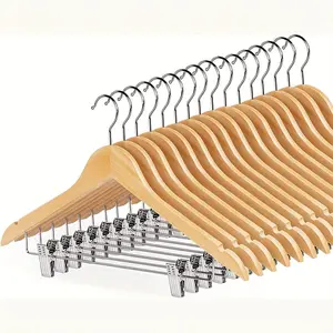 Solid wood hangers set in natural wood color with clips, available in multiple sets. Hanger + pants clip integrated design—hang tops and pants together in one set. Non-slip clamp prevents damage to clothing. Suitable for shirts, dress pants, and suits.