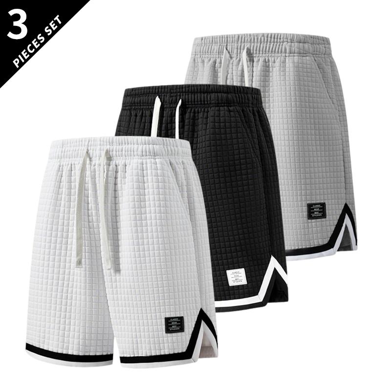 3-pack men’s breathable waffle basketball shorts with an elastic drawstring waist, side pockets, contrast piping, and a split hem—ideal for the gym, running, training, and everyday wear.
