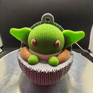 3d printed crocheted look Grogu Christmas ornament.