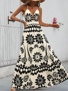 A women's long halter dress with a deep V-neck and a cinched waist, featuring an off-white base with black and white abstract floral patterns. Its style is vintage and fresh, suitable for comfortable and romantic settings such as seaside vacations, casual