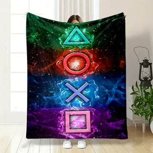 This is a blanket printed with iconic PlayStation buttons. From top to bottom, there is a triangle wrapped in green flames, a circle surrounded by red flames, a cross held up by blue flames,